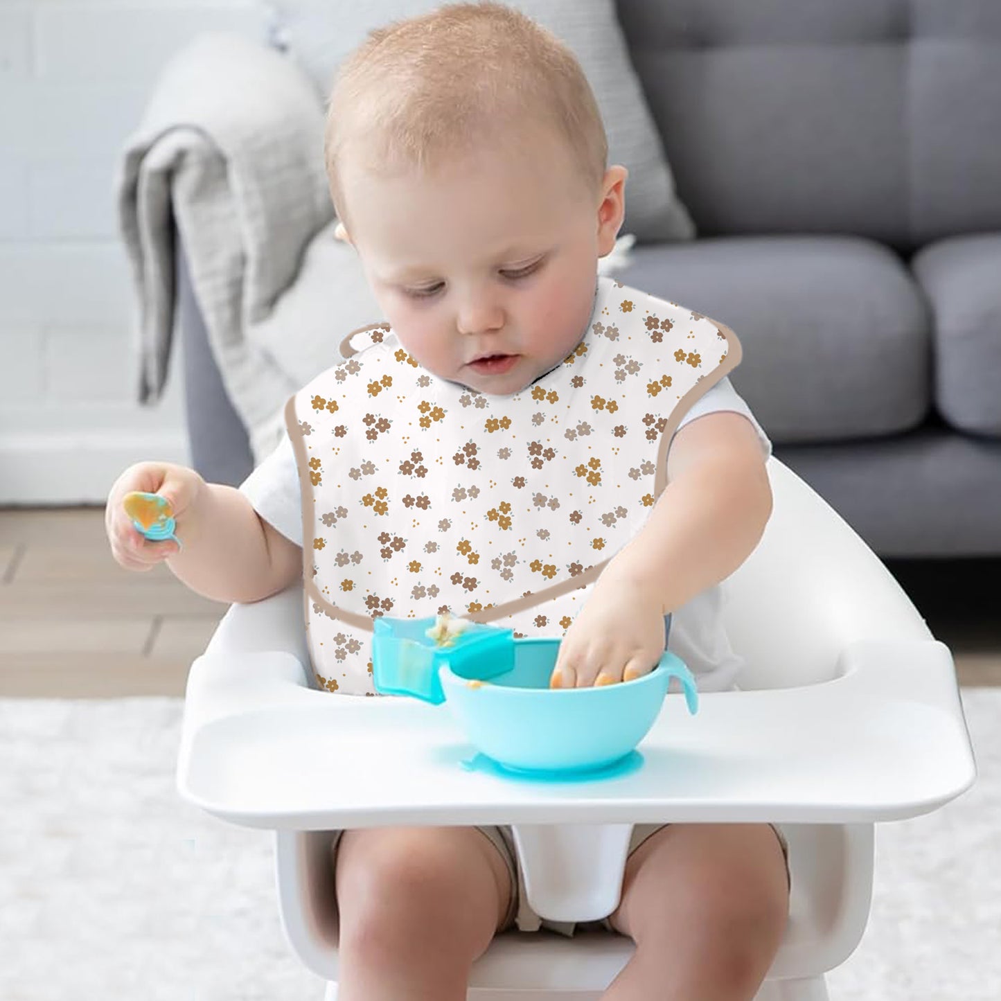 Bavoir bébé imperméable avec poche de récupération avec fleurs