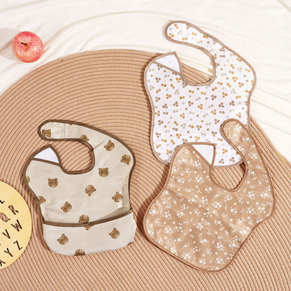 Bavoir bébé imperméable avec poche de récupération brun