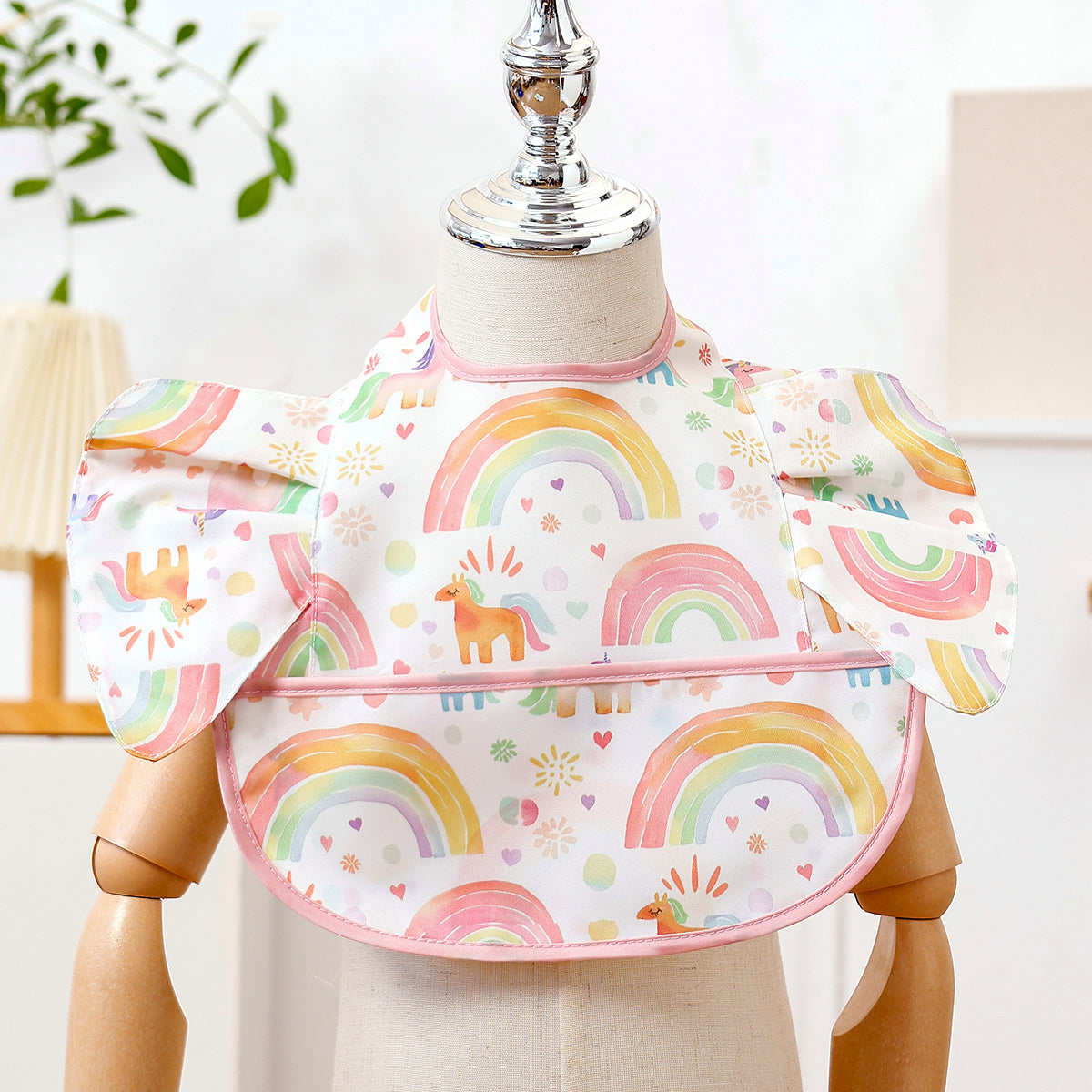 Bavoir bébé imperméable avec poche rose