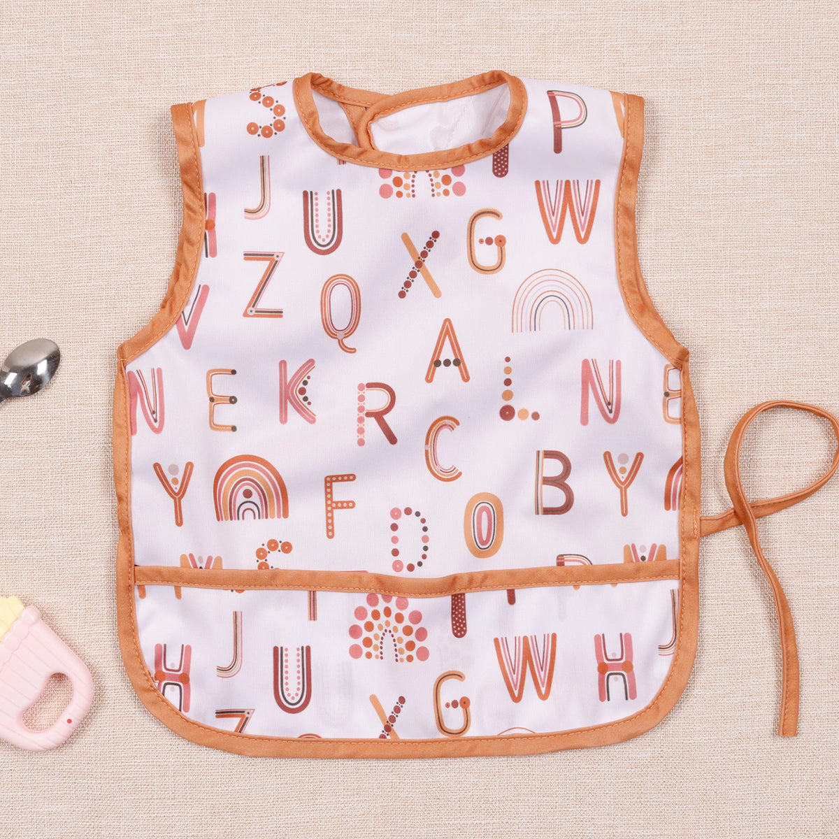 Bavoir bébé-imperméable sans manche alphabétique