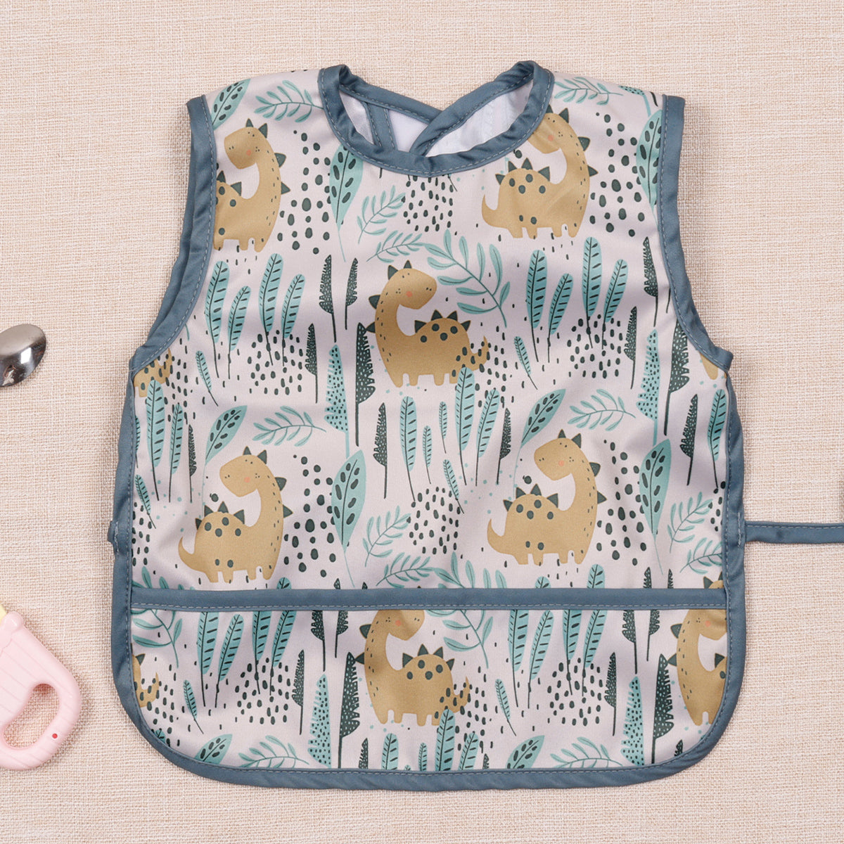 Bavoir bébé imperméable sans manche dino