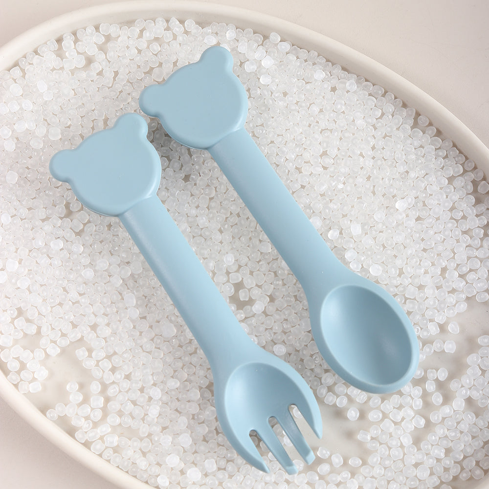 Cuilère ergonomique bébé dans plateau tête ourson bleu