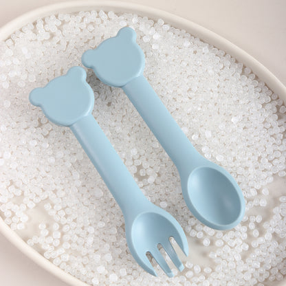 Cuilère ergonomique bébé dans plateau tête ourson bleu